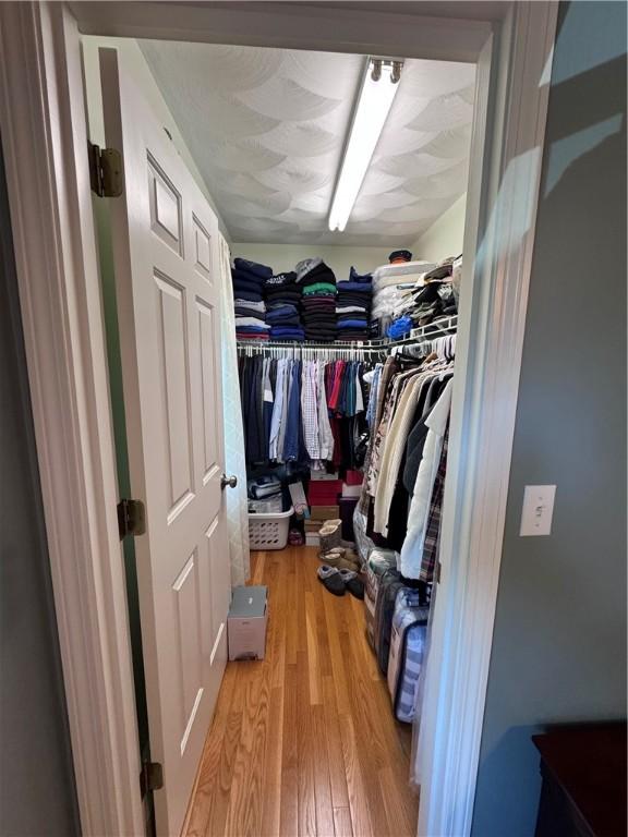 60 Farm Dr, Cumberland, RI 02864 - walk in closet with light wood finished floors