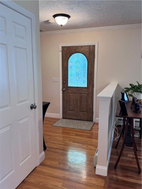 60 Farm Dr, Cumberland, RI 02864 - entrance foyer featuring wood finished floors, ornamental molding, baseboards, and a textured ceiling