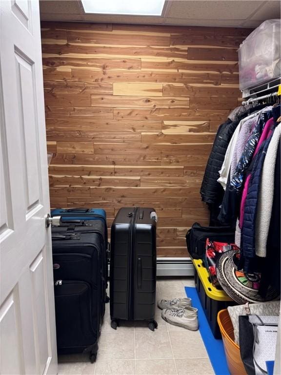 60 Farm Dr, Cumberland, RI 02864 - walk in closet with light tile patterned floors and a baseboard radiator