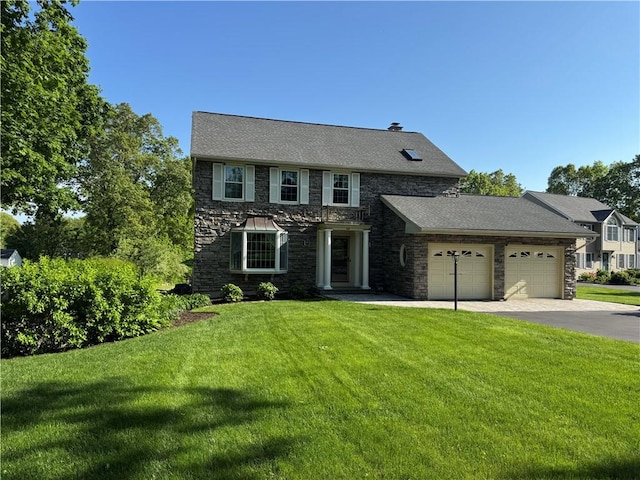 60 Farm Dr, Cumberland, RI 02864 - view of front facade with stone siding, an attached garage, a front yard, and asphalt driveway