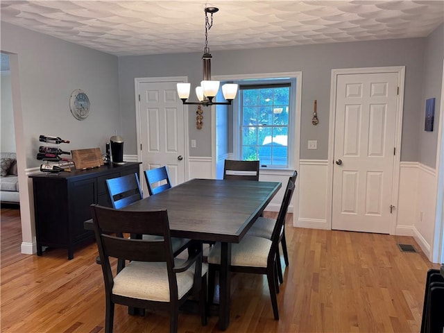 60 Farm Dr, Cumberland, RI 02864 - dining room featuring a chandelier and light wood finished floors