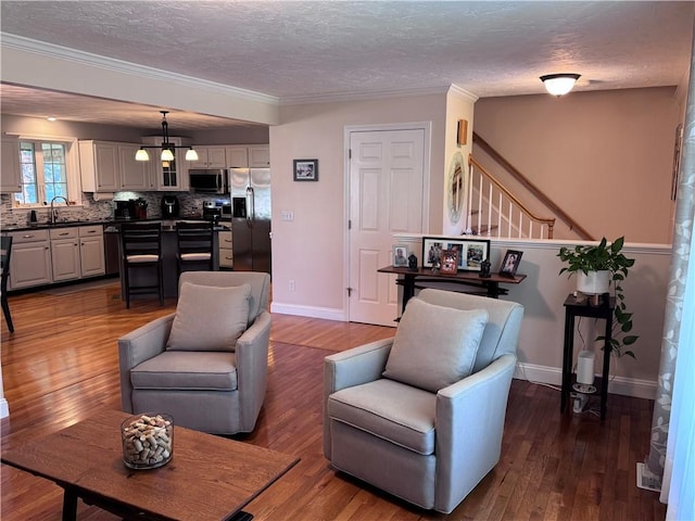 60 Farm Dr, Cumberland, RI 02864 - living room with a textured ceiling, stairway, dark wood-style floors, crown molding, and baseboards