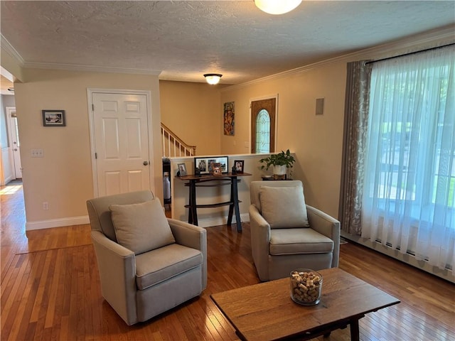 60 Farm Dr, Cumberland, RI 02864 - living room featuring stairs, hardwood / wood-style flooring, crown molding, a textured ceiling, and baseboards