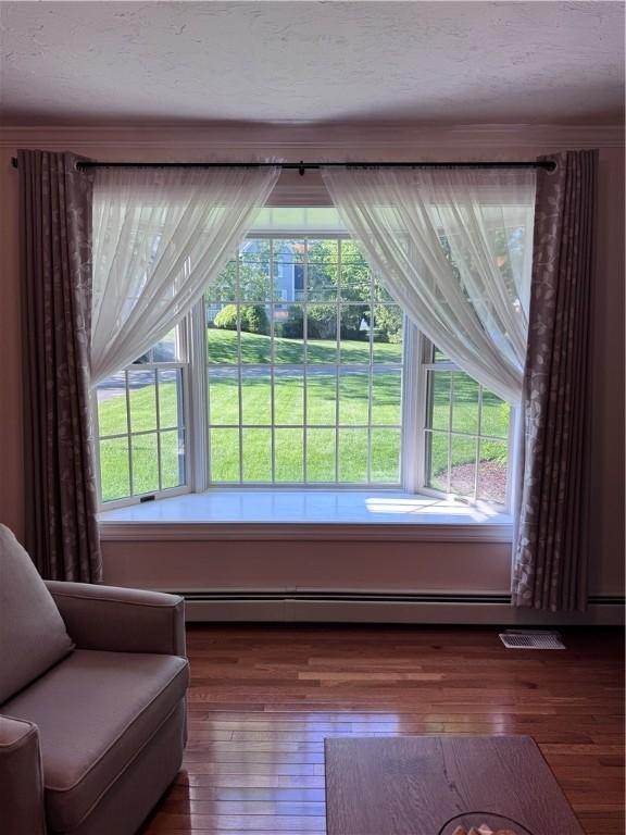 60 Farm Dr, Cumberland, RI 02864 - sitting room with wood-type flooring and plenty of natural light