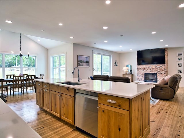 1 Hinter Way, Little Compton, RI 02837 - kitchen featuring a sink, dishwasher, light wood-type flooring, brown cabinets, and a brick fireplace