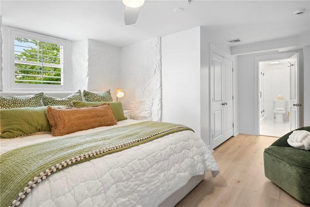426 Spring St Unit B101, Newport, RI 02840 - bedroom with light wood finished floors, ensuite bath, and a ceiling fan