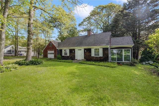 68 Shirley Dr, Charlestown, RI 02813 - view of front of house featuring a front lawn, a chimney, a garage, and a shingled roof