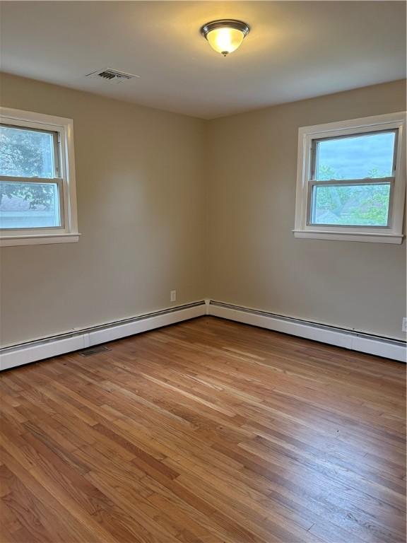 173 Martin St, East Providence, RI 02914 - unfurnished room featuring healthy amount of natural light and wood finished floors