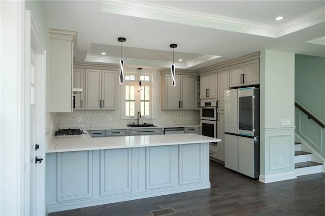 9 Chase Ln, Lincoln, RI 02865 - kitchen with a tray ceiling, a peninsula, crown molding, dark wood finished floors, and backsplash