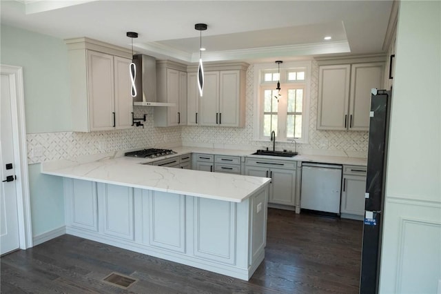 9 Chase Ln, Lincoln, RI 02865 - kitchen featuring dishwasher, wall chimney range hood, a sink, a peninsula, and freestanding refrigerator