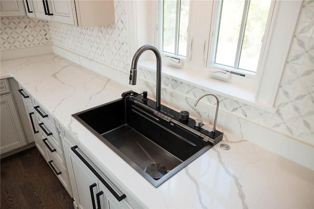 9 Chase Ln, Lincoln, RI 02865 - kitchen featuring a sink and light stone counters