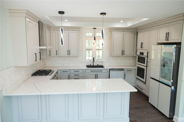 9 Chase Ln, Lincoln, RI 02865 - kitchen featuring appliances with stainless steel finishes, a raised ceiling, a sink, a peninsula, and backsplash