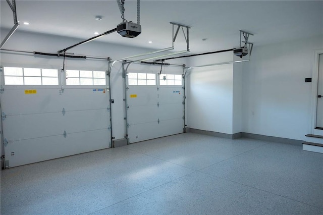 9 Chase Ln, Lincoln, RI 02865 - garage with a garage door opener and baseboards