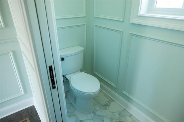 9 Chase Ln, Lincoln, RI 02865 - bathroom featuring toilet and marble look tiles