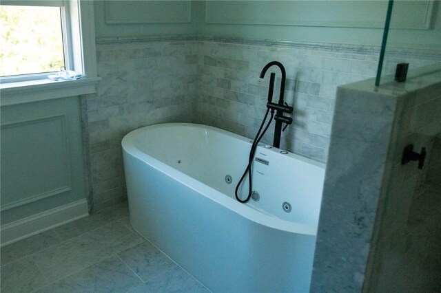 9 Chase Ln, Lincoln, RI 02865 - bathroom with a freestanding tub and tile patterned flooring
