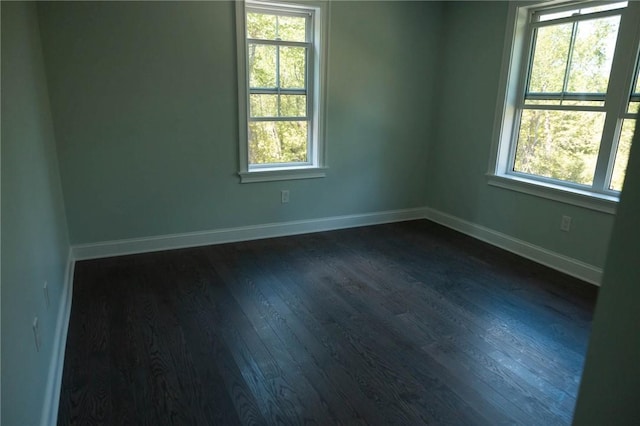 9 Chase Ln, Lincoln, RI 02865 - unfurnished room with plenty of natural light, dark wood-style floors, and baseboards