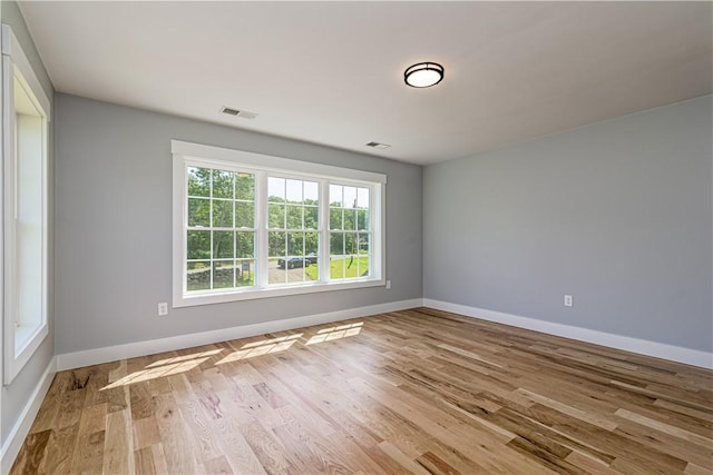 125 Fairview Ave, Hopkinton, RI 02832 - empty room with plenty of natural light and wood finished floors