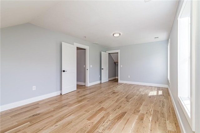 125 Fairview Ave, Hopkinton, RI 02832 - unfurnished bedroom with light wood finished floors and vaulted ceiling