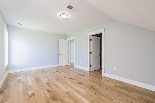 125 Fairview Ave, Hopkinton, RI 02832 - unfurnished bedroom featuring light wood finished floors and vaulted ceiling