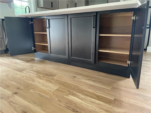 125 Fairview Ave, Hopkinton, RI 02832 - kitchen view of light wood-style floors, open shelves, and light countertops