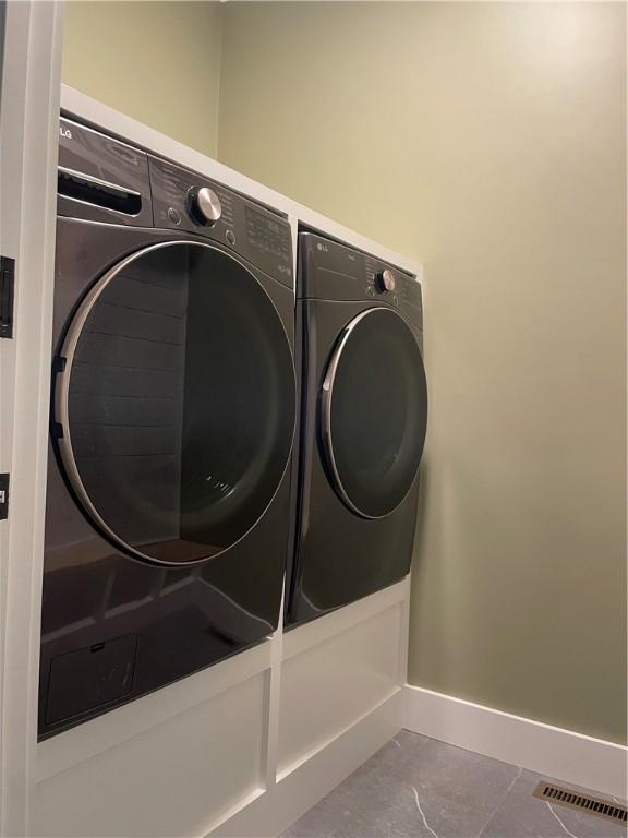 125 Fairview Ave, Hopkinton, RI 02832 - laundry area with separate washer and dryer and baseboards