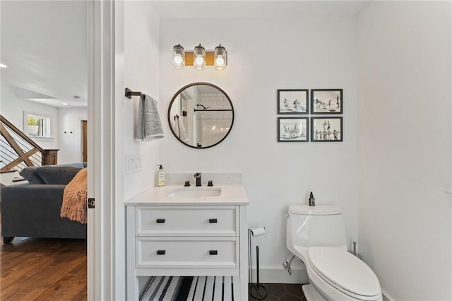 23 Hemlock St, Narragansett, RI 02882 - full bathroom featuring connected bathroom, vanity, baseboards, toilet, and a shower