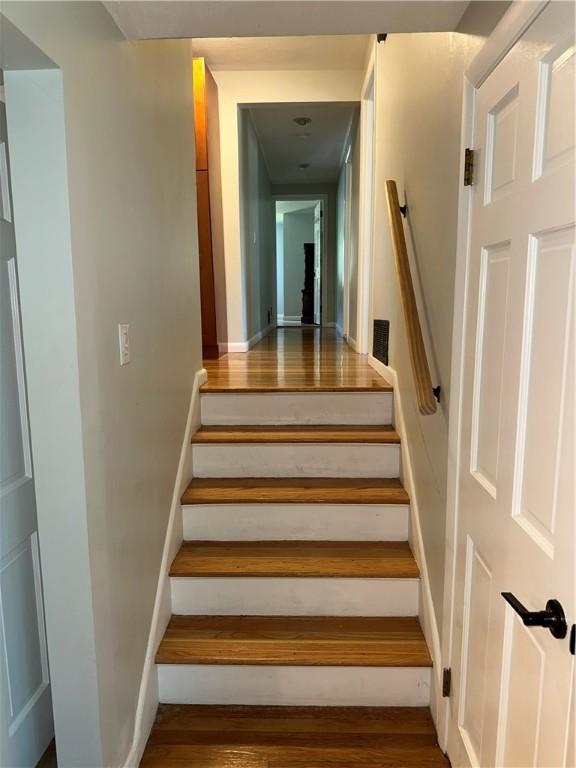 21 Baldwin Rd, Warwick, RI 02886 - stairs featuring wood finished floors
