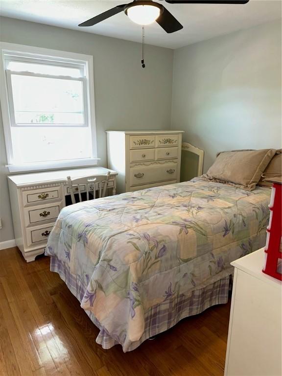 21 Baldwin Rd, Warwick, RI 02886 - bedroom with wood finished floors, ceiling fan, and baseboards