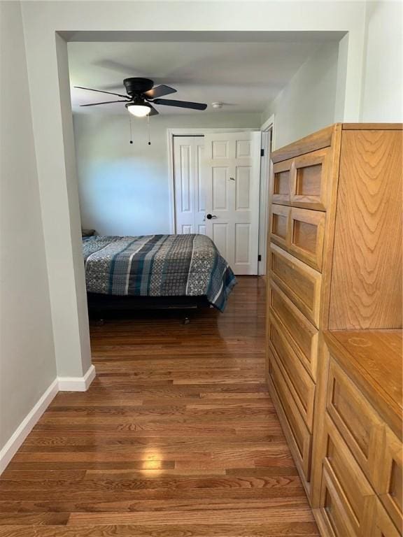 21 Baldwin Rd, Warwick, RI 02886 - bedroom with dark wood-type flooring, baseboards, a closet, and a ceiling fan