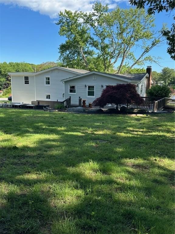 21 Baldwin Rd, Warwick, RI 02886 - back of house featuring a yard