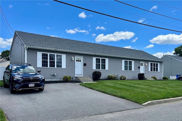 71 Carlton St, Cranston, RI 02910 - view of front of house featuring roof with shingles and a front yard