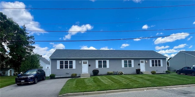 71 Carlton St, Cranston, RI 02910 - single story home featuring entry steps, a front lawn, and asphalt driveway