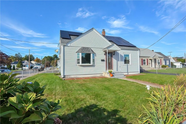 822 Cottage St, Pawtucket, RI 02861 - view of front of home with a chimney and roof mounted solar panels