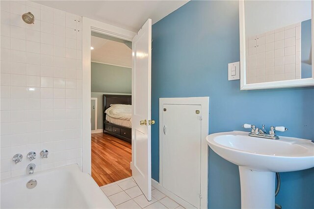 822 Cottage St, Pawtucket, RI 02861 - ensuite bathroom featuring a tub to relax in and tile patterned flooring