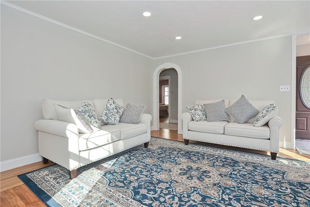 822 Cottage St, Pawtucket, RI 02861 - living area with arched walkways, ornamental molding, baseboards, wood finished floors, and recessed lighting