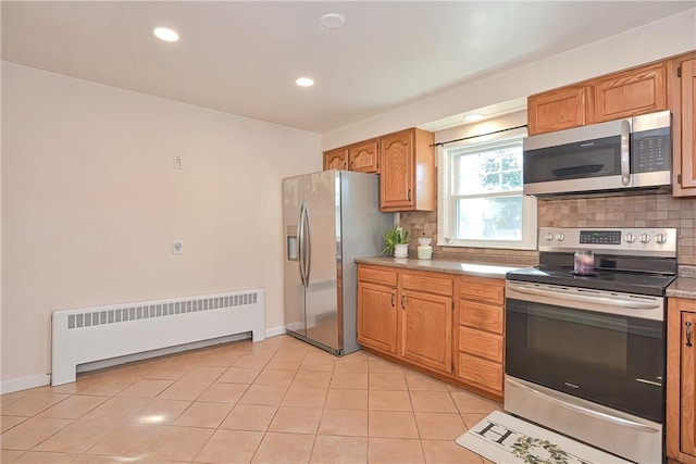 822 Cottage St, Pawtucket, RI 02861 - kitchen featuring appliances with stainless steel finishes, radiator, tasteful backsplash, light tile patterned floors, and recessed lighting