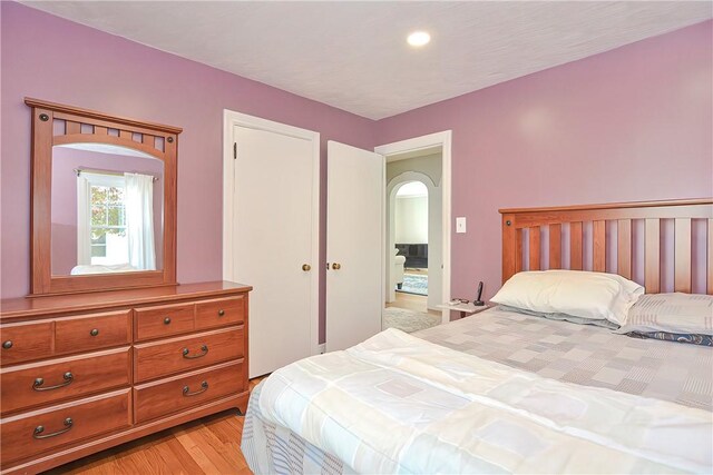 822 Cottage St, Pawtucket, RI 02861 - bedroom with arched walkways and light wood finished floors