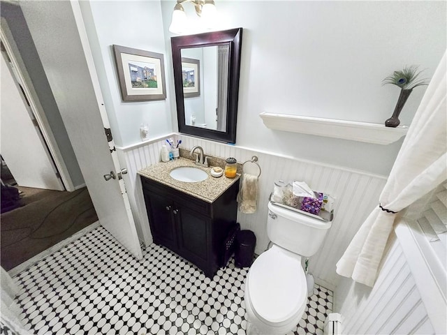 294 Railroad Ave, North Kingstown, RI 02874 - bathroom with wainscoting, toilet, and vanity