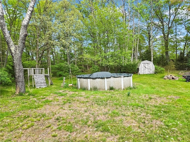 294 Railroad Ave, North Kingstown, RI 02874 - view of green lawn with a covered pool