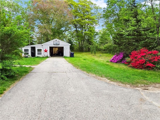 294 Railroad Ave, North Kingstown, RI 02874 - view of pole building with a yard and asphalt driveway