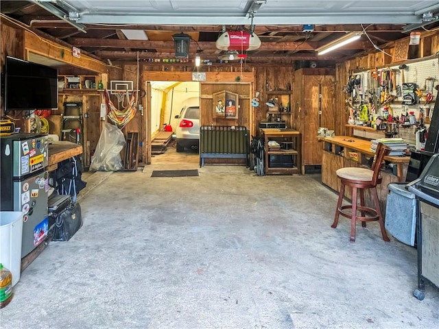 294 Railroad Ave, North Kingstown, RI 02874 - garage featuring a garage door opener and a workshop area