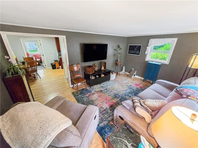 294 Railroad Ave, North Kingstown, RI 02874 - living room featuring healthy amount of natural light, wood finished floors, and ornamental molding