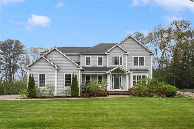 397 Sylvan Ct, North Kingstown, RI 02874 - traditional-style home with a front yard and a shingled roof