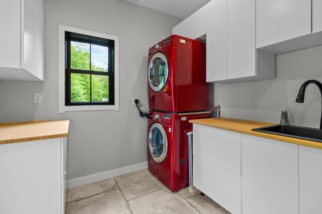 45 Lloyd Bowen Ct, Glocester, RI 02814 - washroom featuring cabinet space, estacked washer and dryer, and baseboards