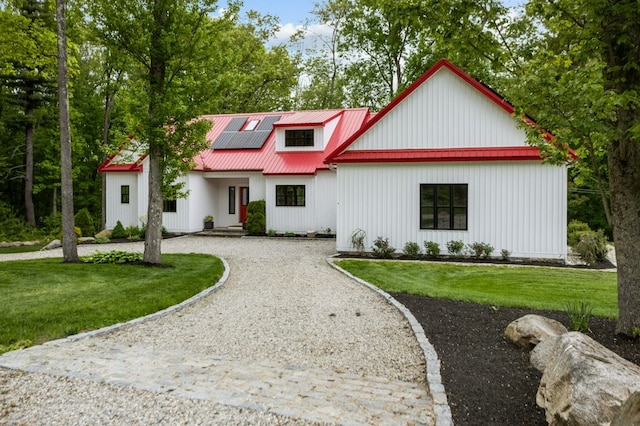 45 Lloyd Bowen Ct, Glocester, RI 02814 - modern inspired farmhouse with gravel driveway, solar panels, metal roof, and a front lawn