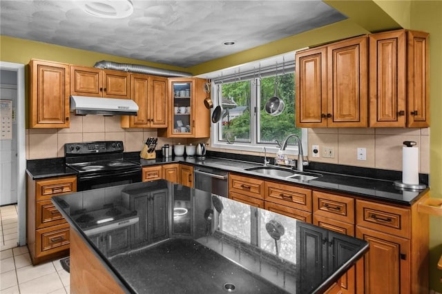 53 Morgan Ct, North Kingstown, RI 02852 - kitchen with electric range, under cabinet range hood, stainless steel dishwasher, and brown cabinetry