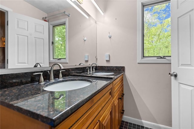53 Morgan Ct, North Kingstown, RI 02852 - bathroom with double vanity and tile patterned flooring