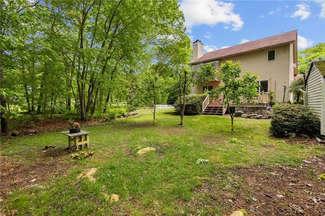 53 Morgan Ct, North Kingstown, RI 02852 - view of green lawn featuring a wooden deck