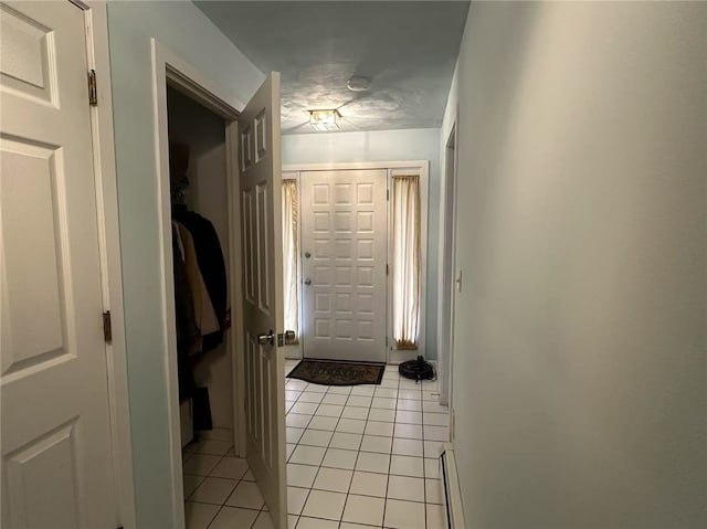 53 Morgan Ct, North Kingstown, RI 02852 - entryway with light tile patterned floors and a baseboard radiator
