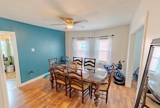 12 Hamilton St, Providence, RI 02907 - dining room with light wood-style flooring, a ceiling fan, and baseboards